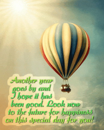 Beautiful multi-colored balloon in animated sunlight. Beautiful birthday congratulations.