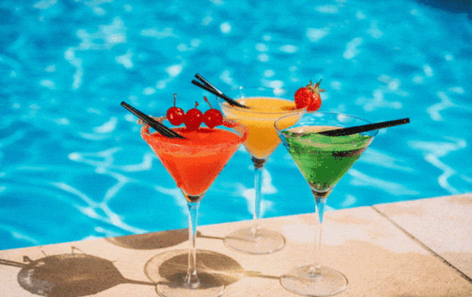 Festive drinks by the pool. Birthday party atmosphere.