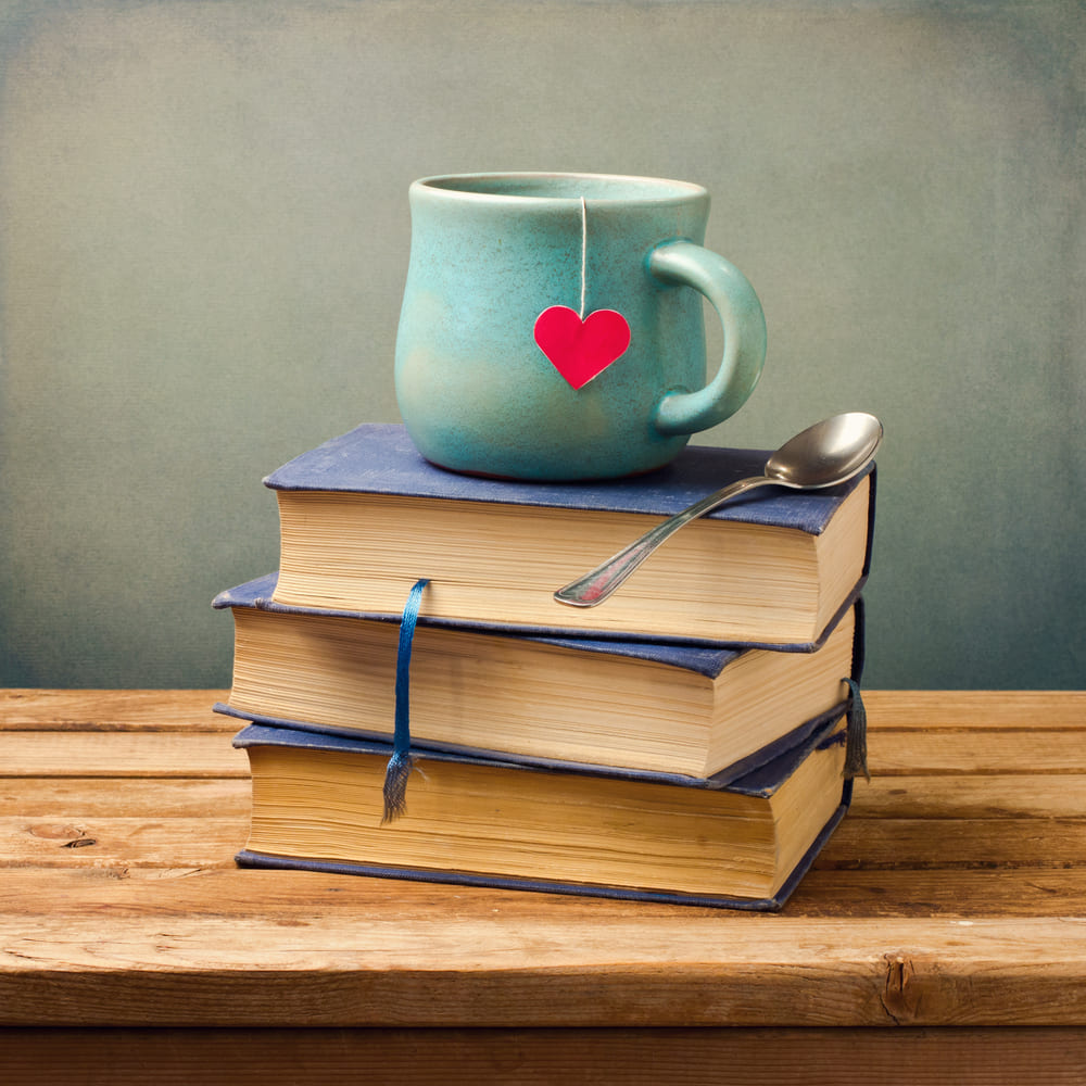Stylish image - cup, books and heart.