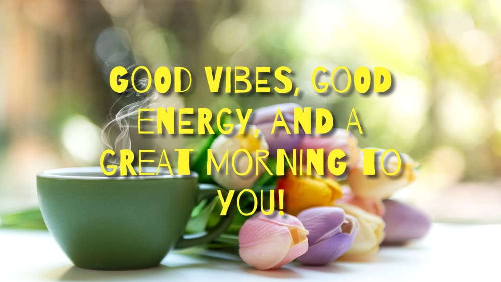 Photo of a beautiful bouquet of multi-colored tulips and a hot cup of morning coffee. Good vibes, good energy, and a great morning to you!
